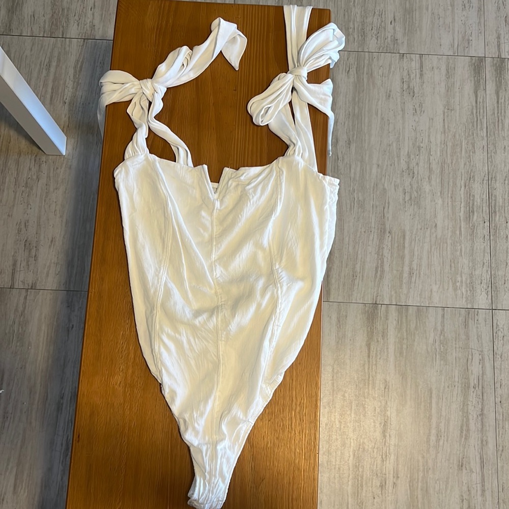Free People white bodysuit with tie sleeves